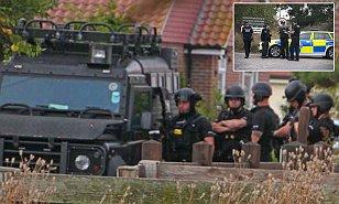 Armed police are locked in a 18-hour stand-off with a 72-year-old gunman who has barricaded himself inside a house and is 'making threats'